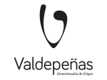 Logo with a stylized black grape shape above the word Valdepeñas in bold, modern font. Below Valdepeñas, smaller text reads Denominación de Origen on a light background.